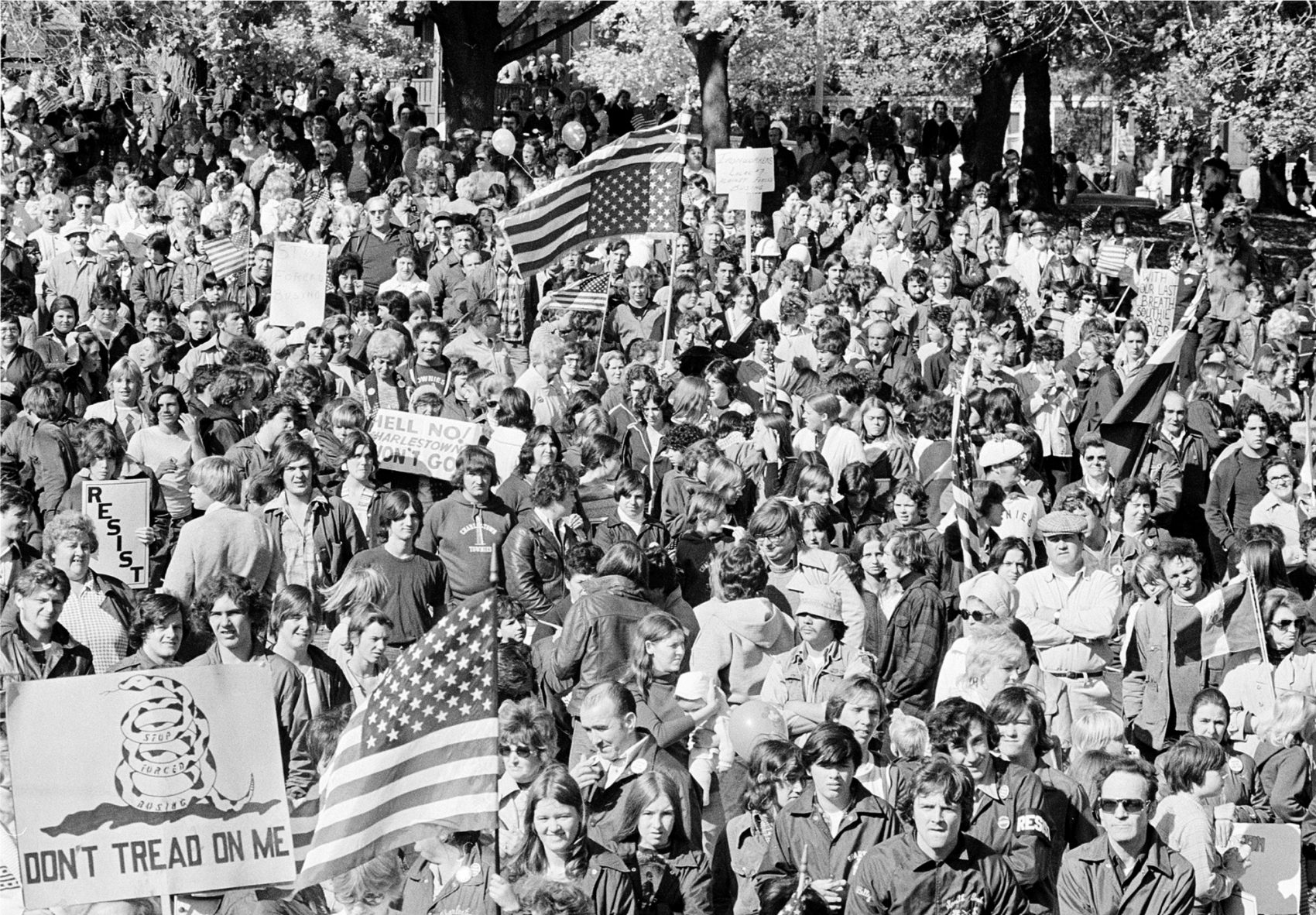 Is it possible, writes Lindsey Danis, that the recent uptick in hate crimes in the state can help Massachusetts finally get over its history of hate? Pictured: An estimated 7,000 marchers gather to protest forced school busing in South Boston, Ma., Monday, Oct. 27, 1975. The rally coincides with a boycott of schools by most white students. (Peter Bregg/AP)