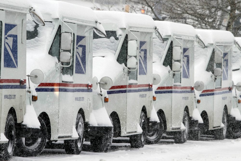 In an ever-changing Downtown Crossing, writer Mary Rae found one constant: A postal worker named Harvey whose notes and demeanor brightened her days. Pictured: Snow-covered U.S. Postal Service vehicles sit idle Feb. 9, 2015, in Marlborough, Mass. (Bill Sikes/AP)