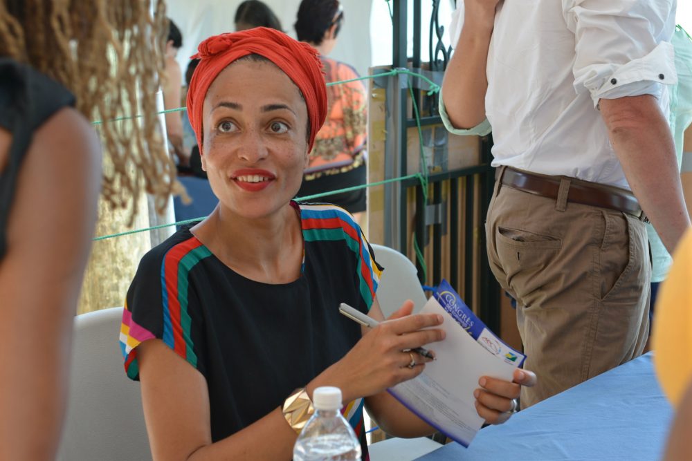 It's important, writes Layla Schlack, for those of us who claim to be progressive, anti-racist, feminist, pro-equal rights, to understand what it's like not being part of the dominant culture. Pictured: Novelist Zadie Smith is shown signing a book for a fan. (David McFadden/AP)