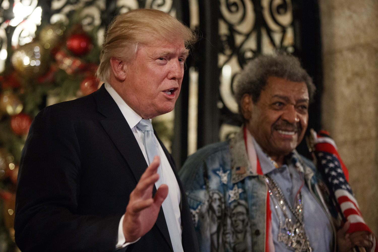 President-elect Donald Trump, left, stands with boxing promoter Don King as he speaks to reporters at Mar-a-Lago, Wednesday, Dec. 28, 2016, in Palm Beach, Fla. (Evan Vucci/AP)