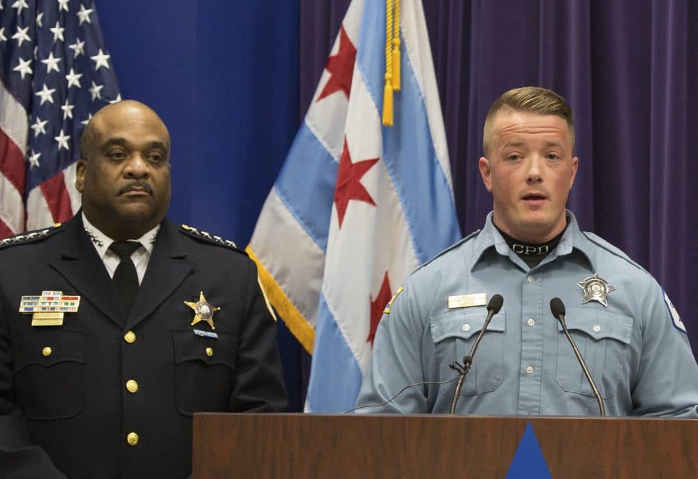 Chicago Police Officer Mike Donnelly, accompanied by Police Superintendent Eddie Johnson, left, speaks at a news conference Thursday, Jan. 5, 2017, in Chicago. Johnson said four black people have been charged with hate crimes in connection with a video broadcast live on Facebook that showed an assault on a mentally disabled white man. Donnelly was one of the first officers on the scene. (Teresa Crawford/AP)