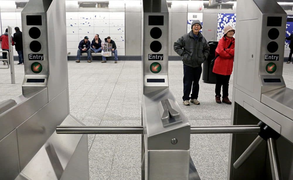 Commuters look at art by Sarah Sze at the 96th St. Q train station on the newly opened Second Avenue subway line on Jan. 1, 2017 in New York. (Yana Paskova/Getty Images)