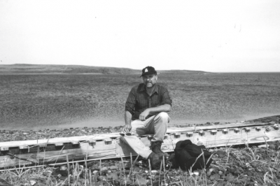 Author Lawrence Millman sits on a dogsled. (Courtesy Lawrence Millman)