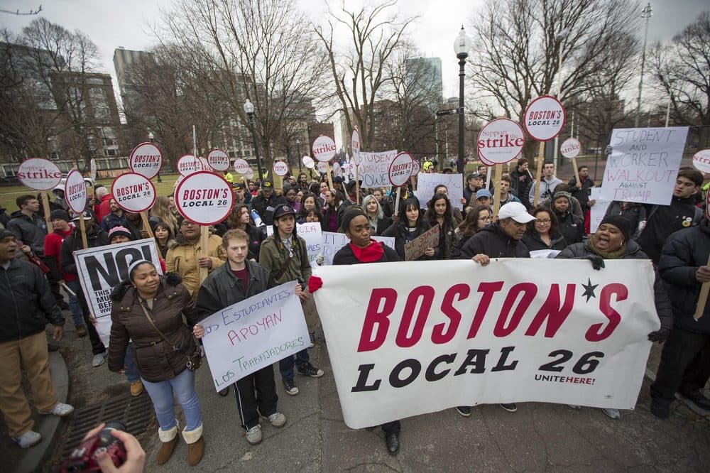 Foodservice workers and students from Northeastern University join the rally on Boston Common. (Jesse Costa/WBUR)