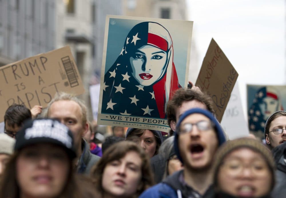 Demonstrators march on the street near a security checkpoint inaugural entrance ahead of President-elect Donald Trump's inauguration. Protesters pitching diverse causes but united against the incoming president are making their mark on Inauguration Day. (Jose Luis Magana/AP)