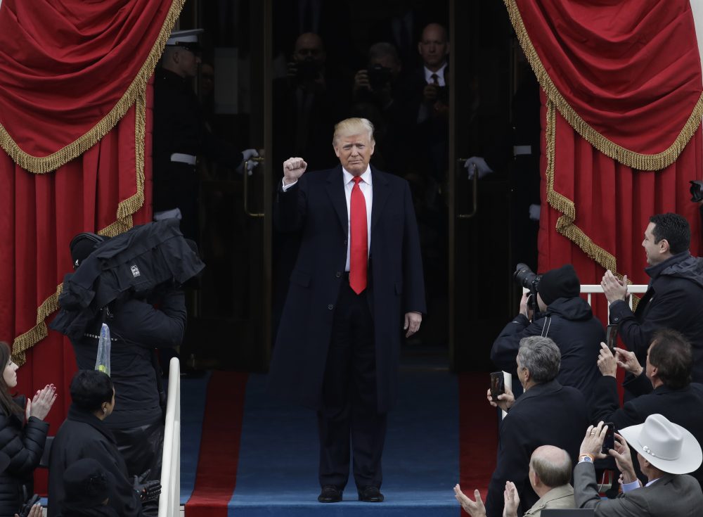 President-elect Donald Trump pumps his fist as he arrives. (Patrick Semansky/AP)