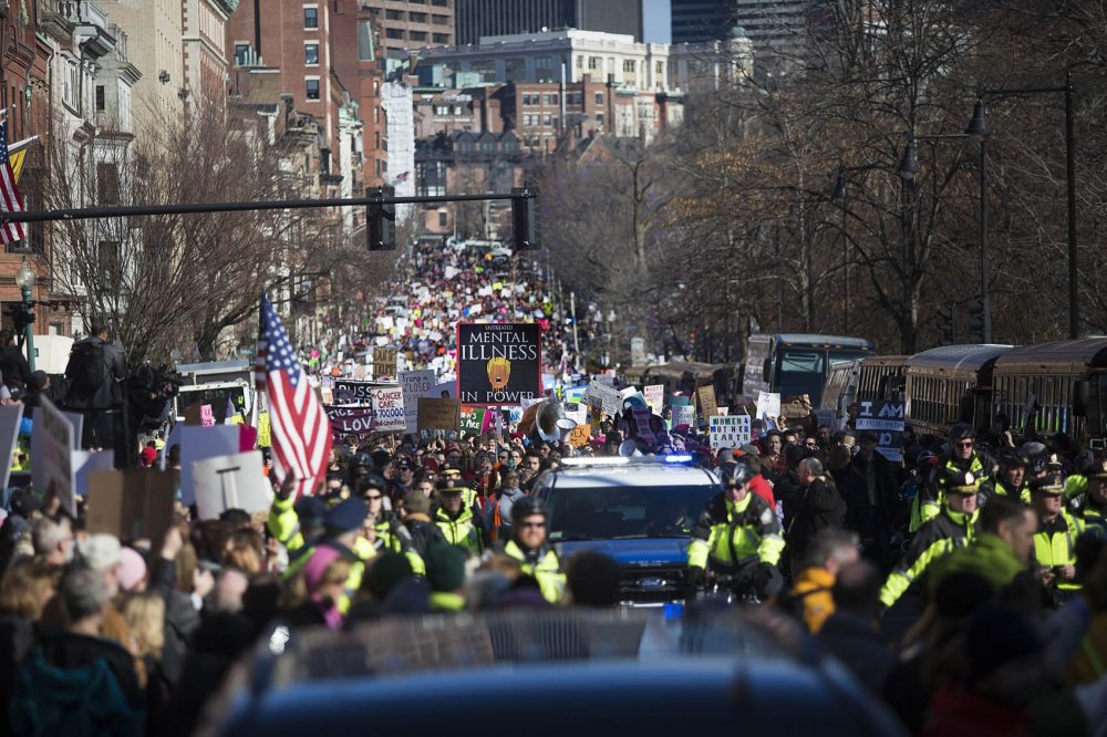 The Boston Police lead the way for the Women's March in Boston as it stretches down Beacon Street on Saturday. (Jesse Costa/WBUR)
