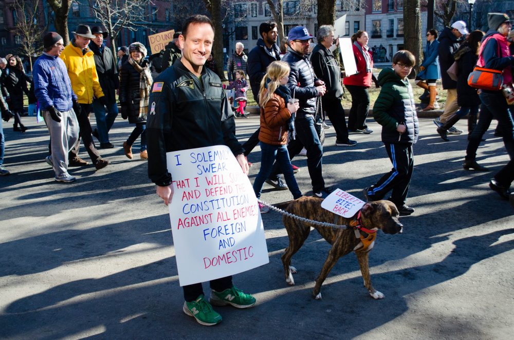 Dan Futrell and his dog, Liberty, were a crowd favorite on the march down Commonwealth Avenue. (Elizabeth Gillis/WBUR)