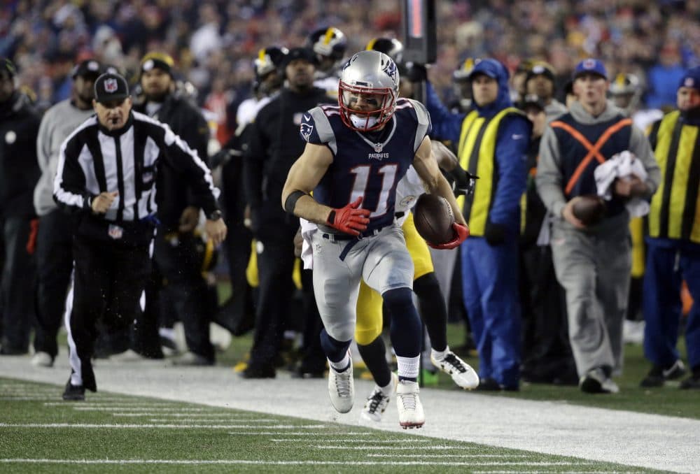 New England Patriots wide receiver Julian Edelman runs after catching a pass during the second half of the AFC championship game in Foxborough, Mass. (Steven Senne/AP)