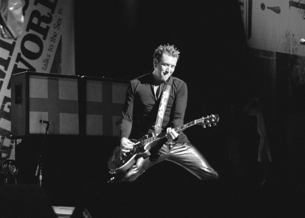 Steve Jones playing during the 1996 reunion tour in L.A. (Courtesy De Capo Press) 