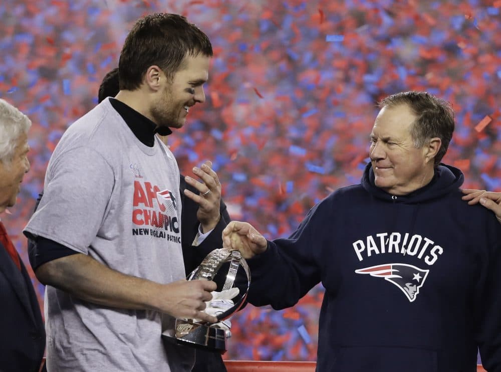 Brady holds the AFC Championship trophy as he celebrates with head coach Belichick after the AFC championship win against the Pittsburgh Steelers. (Matt Slocum/AP)