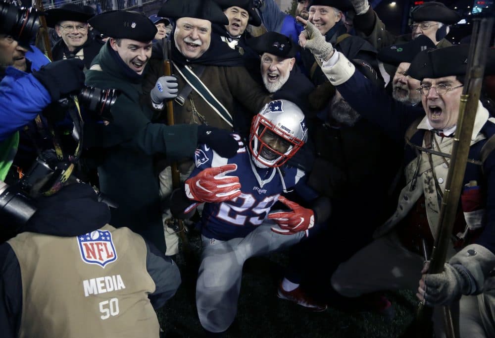New England Patriots running back LeGarrette Blount celebrates a touchdown with the End Zone Militia during the second half of this year's AFC championship. (Elise Amendola/AP)