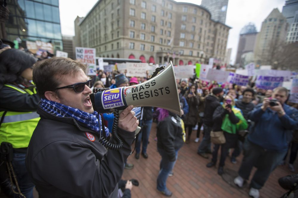 Organizers start to rally the crowd in Copley Square. (Jesse Costa/WBUR)
