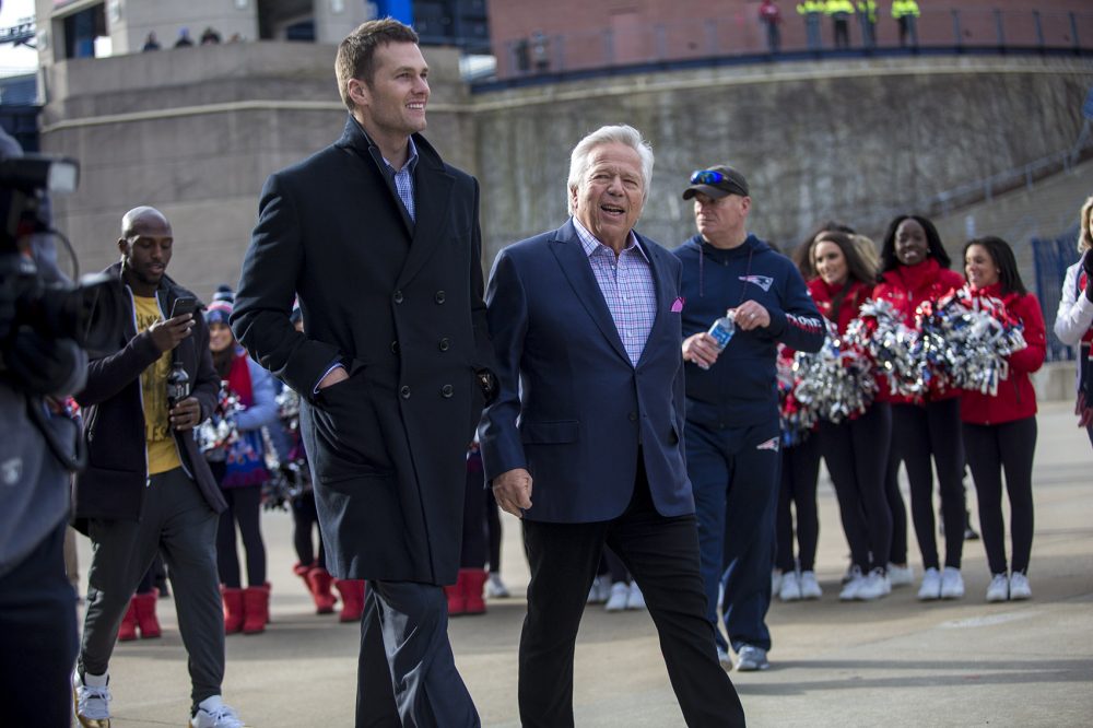 Brady and team owner Robert Kraft enter the festivities. (Jesse Costa/WBUR)