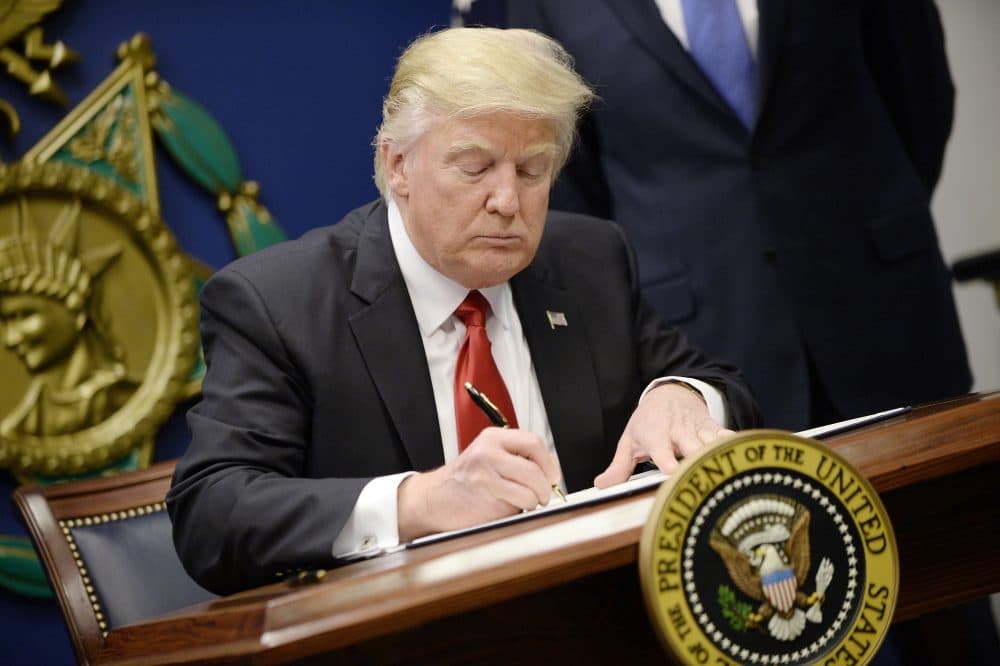 President Donald Trump signs executive orders in the Hall of Heroes at the Department of Defense on Jan. 27, 2017 in Arlington, Va. Trump signed two orders calling for the &quot;great rebuilding&quot; of the nation's military and the &quot;extreme vetting&quot; of visa seekers from seven countries with predominately Muslim populations. (Olivier Douliery-Pool/Getty Images)