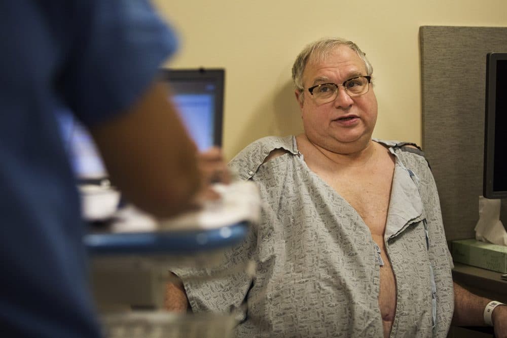 Ron Dombrowski answers questions during a pre-op appointment. (Jesse Costa/WBUR)