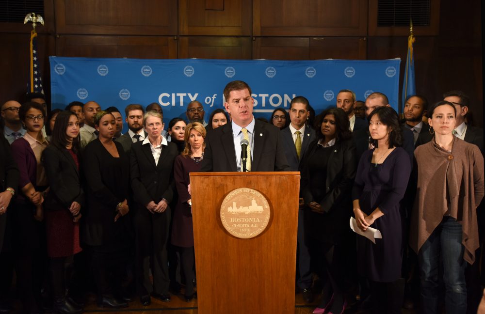 Surrounded by members of his administration and state lawmakers, Mayor Marty Walsh speaks about President Trump's immigration executive orders. (Courtesy of Isabel Leon/Mayor's Office)