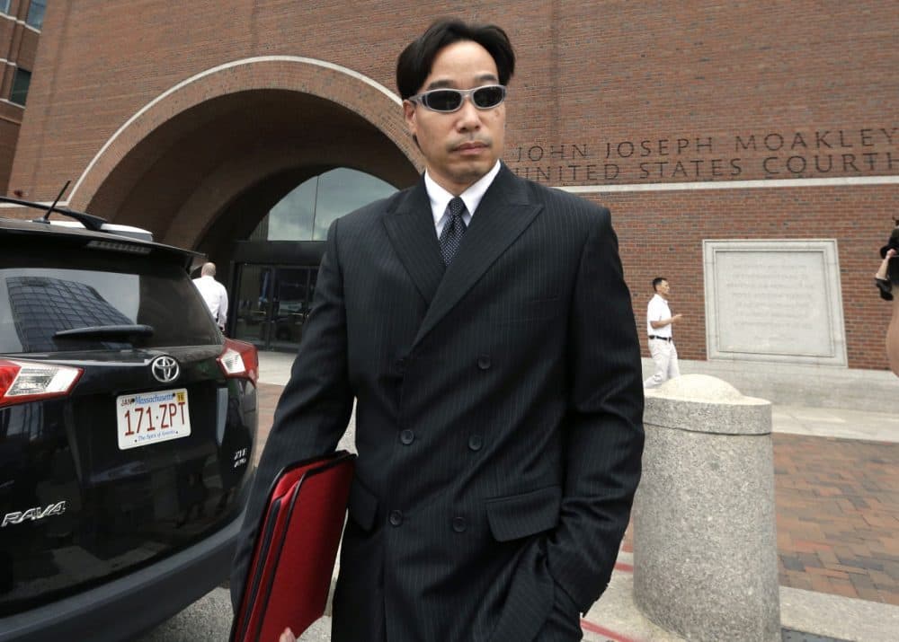 Glenn Chin, former supervisory pharmacist at the New England Compounding Center, leaves federal court in Boston after pleading not guilty in 2014. (Steven Senne/AP)