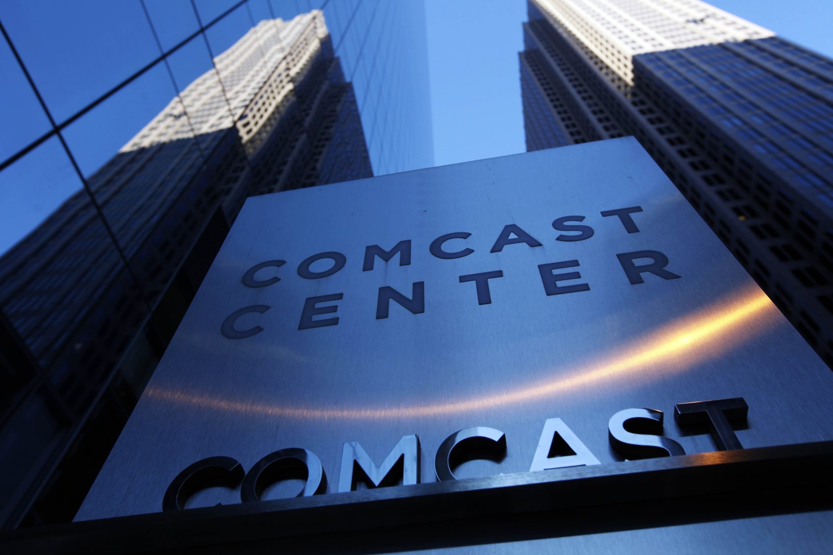 In this Dec. 3, 2009 file photo, a sign outside the Comcast Center is seen in Philadelphia. A federal appeals court has upheld the government's "net neutrality" rules that require internet providers to treat all web traffic equally. Providers like Comcast, Verizon and AT&T say the rules threaten innovation and undermine investment in broadband infrastructure. (AP Photo/Matt Rourke, File)