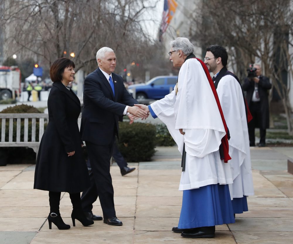 Vice President-elect Mike Pence and his wife Karen are greeted by. Rev. Luis Leon as they arrive at St. John’s Episcopal Church. (Alex Brandon/AP)