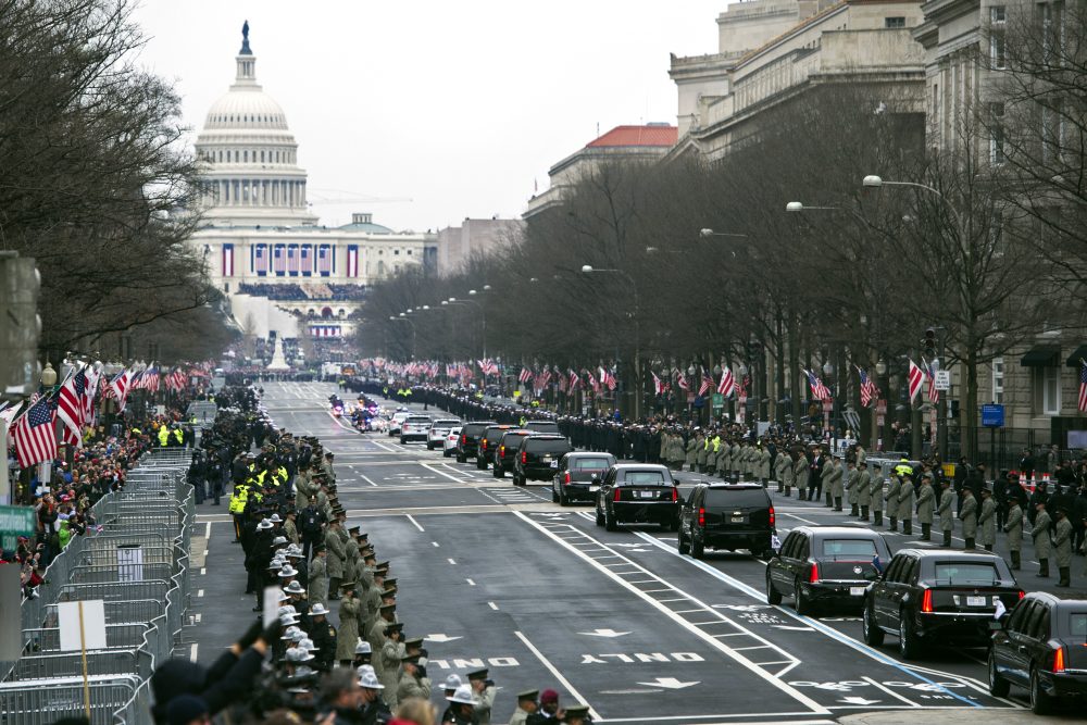 The presidential motorcade drives on Pennsylvania Avenue to the Capitol for the inauguration of President-elect Donald Trump. (Cliff Owen/AP)