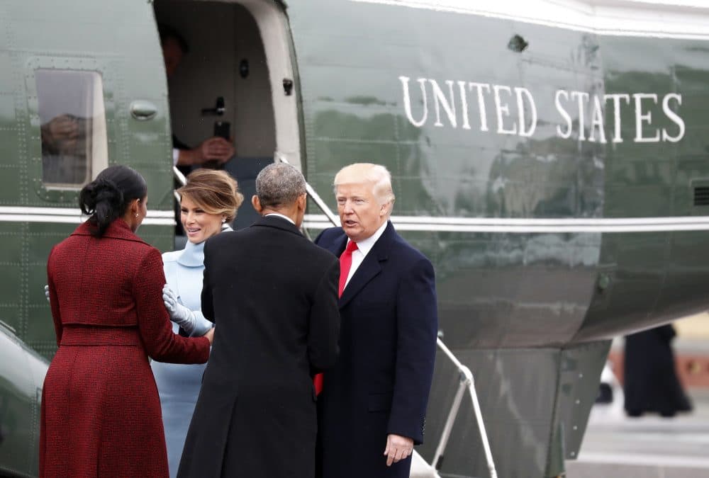 Former First Lady Michelle Obama and First Lady Melania Trump talk as President Donald Trump talks with former President Obama during a departure ceremony on the East Front of the U.S. Capitol Friday. (Alex Brandon/AP)