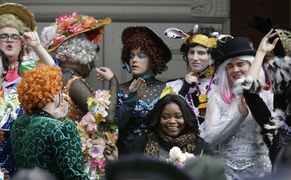 Actress Octavia Spencer poses with members of Harvard's Hasty Pudding troupe. (Stephan Savoia/AP)