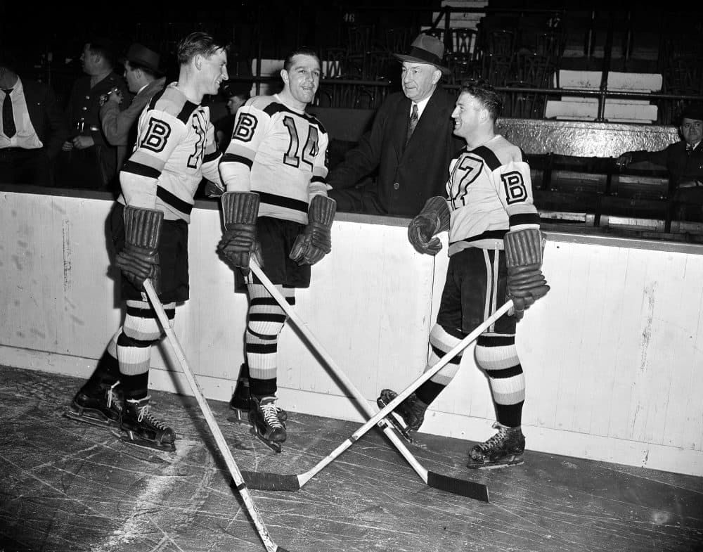 Milt Schmidt, Porky Dumart and Bobby Bauer pictured with Boston Bruins' manager &quot;Uncle Arthur&quot; Ross at practice in Boston Garden on Oct. 23, 1945. (AP File Photo)