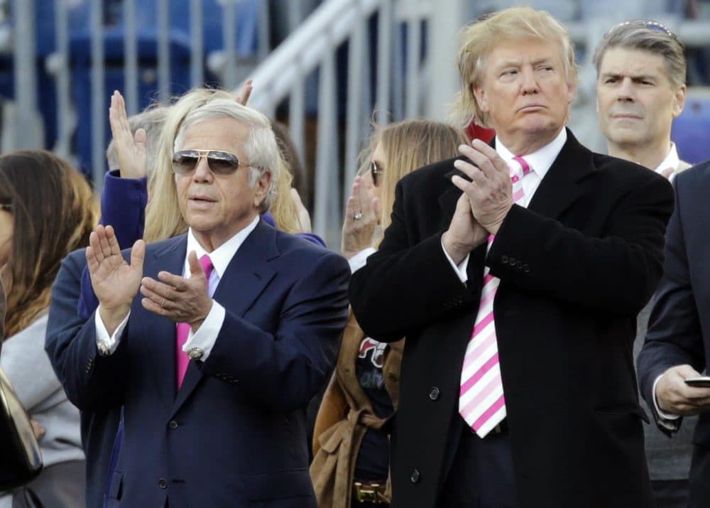 Patriots owner Robert Kraft, left, and Donald Trump, right, stand on the field before a Patriots-Jets game in 2012. (Charles Krupa/AP)
