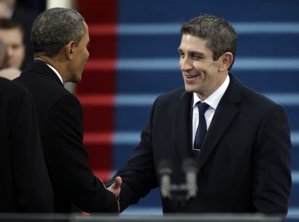 President Barack Obama, left, shakes hands with poet Richard Blanco during the 57th Presidential Inauguration in Washington, Jan. 21, 2013. (Pablo Martinez Monsivais/AP)