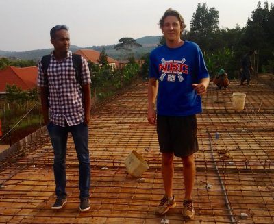 Evan Petty and Allen VR Stanley's engineer on the roof of the gymnasium the school is building. (Courtesy Evan Petty)