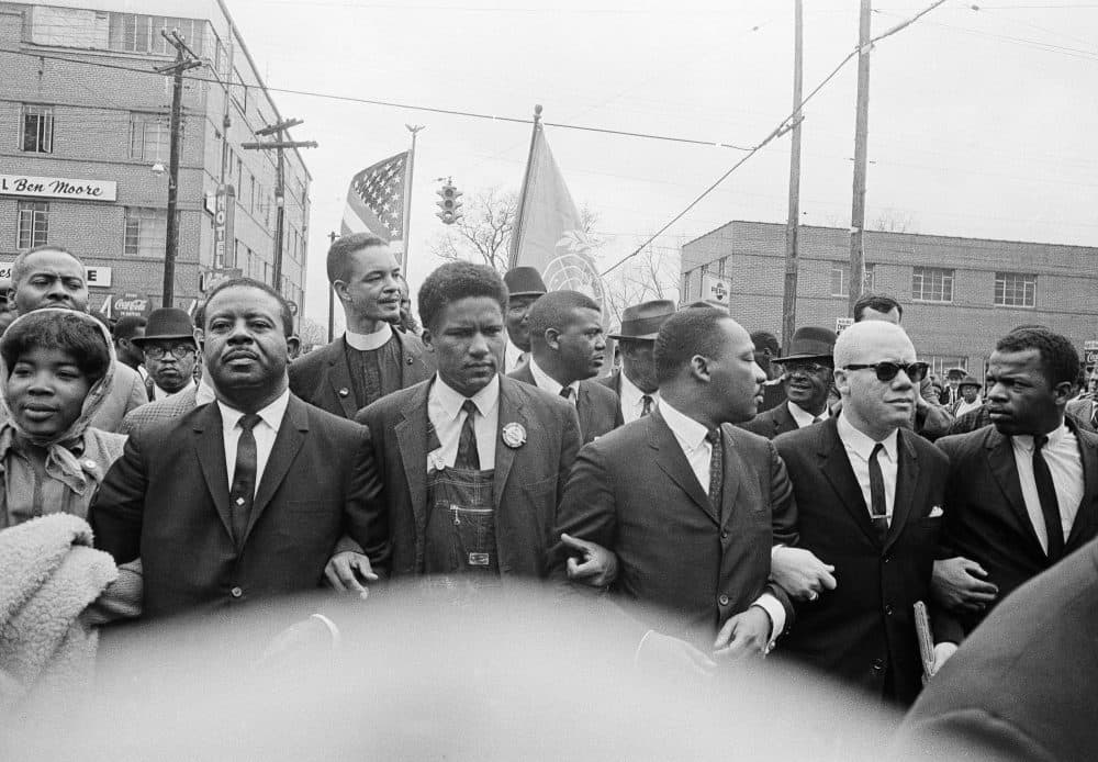 Dr. Martin Luther King Jr. locks arms with his aides as he leads a march of several thousands to the court house in Montgomery, Alabama, on March 17, 1965. From left: Rev. Ralph Abernathy, James Foreman, King, Jesse Douglas Sr. and John Lewis. (AP)