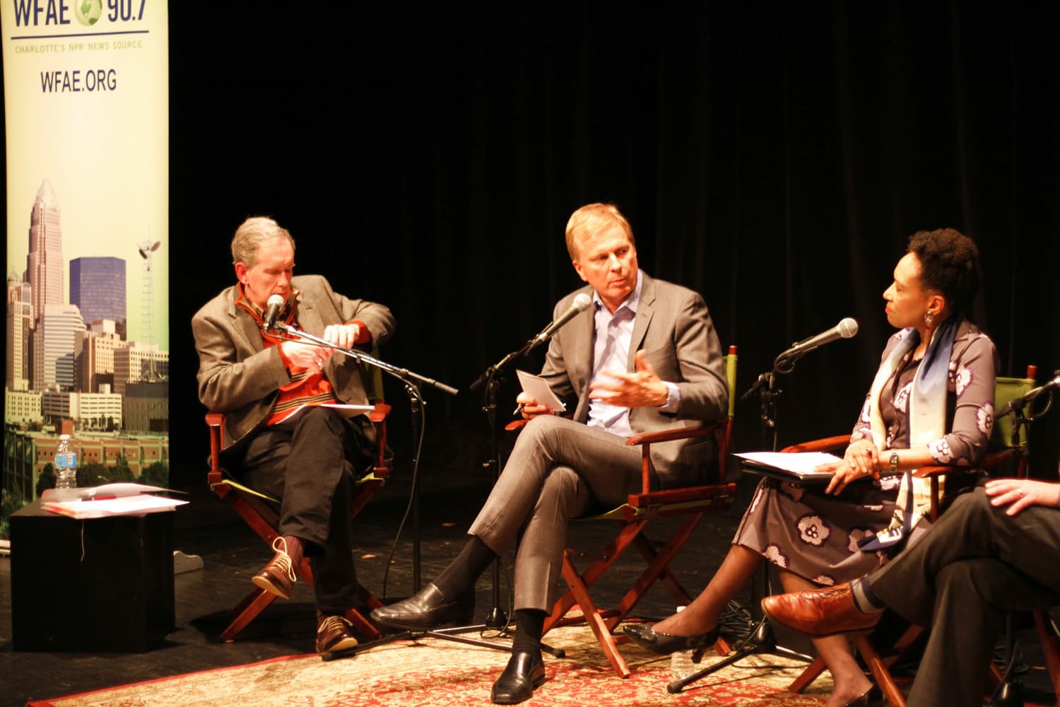 Charlotte Talks host Mike Collins, On Point Tom Ashbrook and Roll Call columnist Mary Crutis at a special live taping of Charlotte Talks in Charlotte, NC's Duke Energy Theater at Spirit Square. (Jenifer Roser/WFAE)