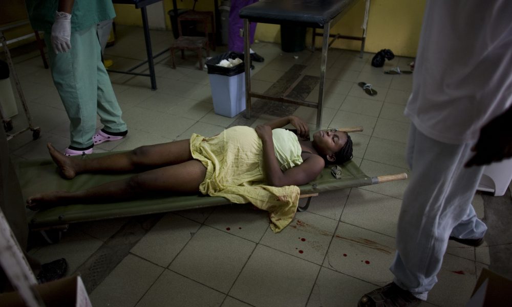 A woman in labor lies on a stretcher at the maternity ward of a Doctors Without Borders hospital in Port-au-Prince, on Jan. 19, 2009. (Ariana Cubillos/AP)