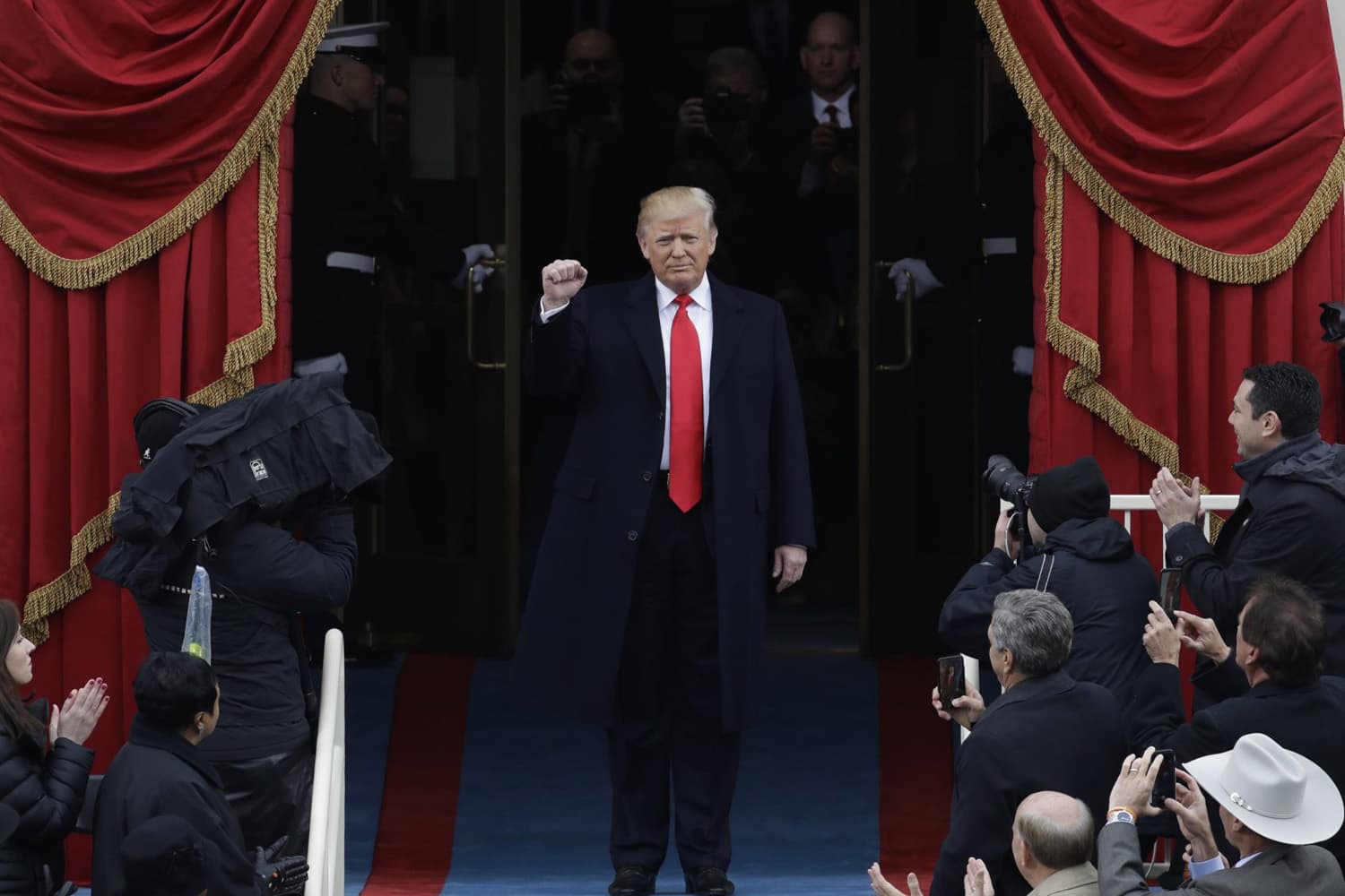 President-elect Donald Trump pumps his fist as he arrives. (Patrick Semansky/AP)