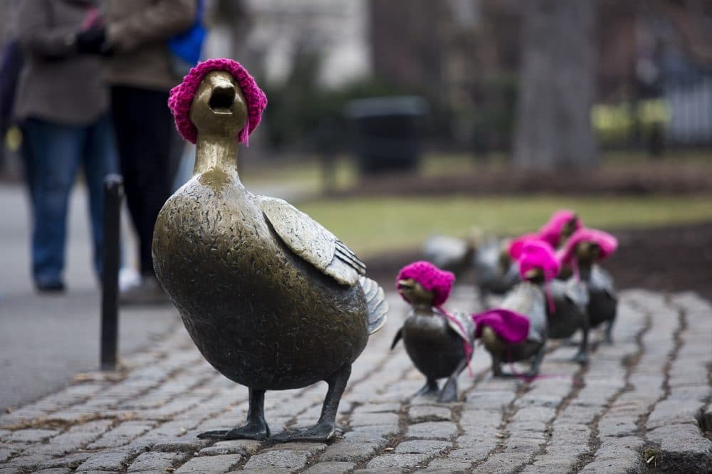 The &quot;Make Way For Ducklings&quot; statutes in Boston's Public Garden wear pink hats for the Women's March. (Jesse Costa/WBUR)