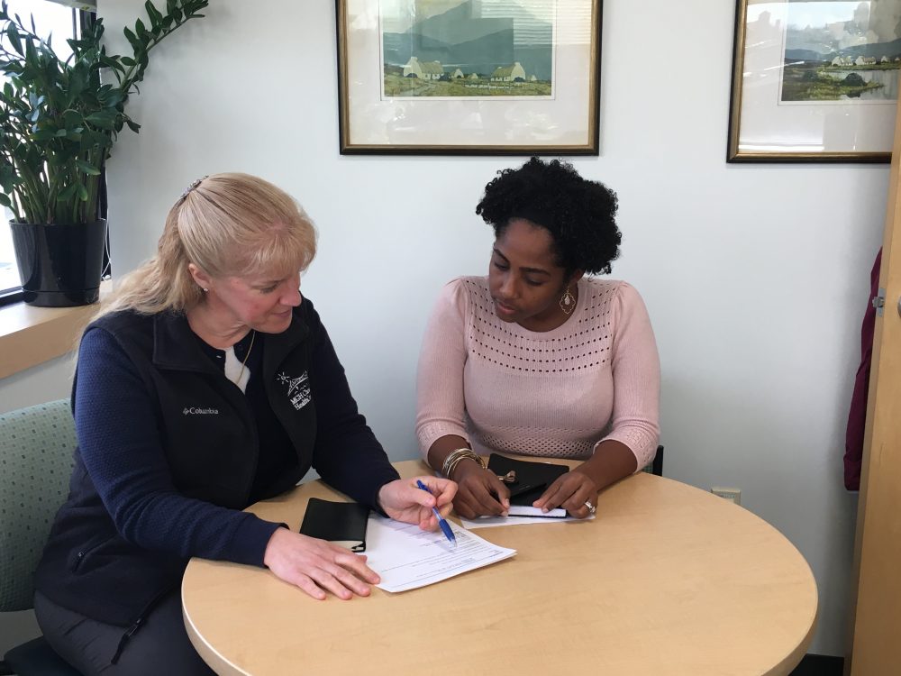 Sarah Abernethy Oo and Tatiana Schettini are part of the team that provides immigrants and refugees health care at MGH Chelsea. (Deborah Becker/WBUR)