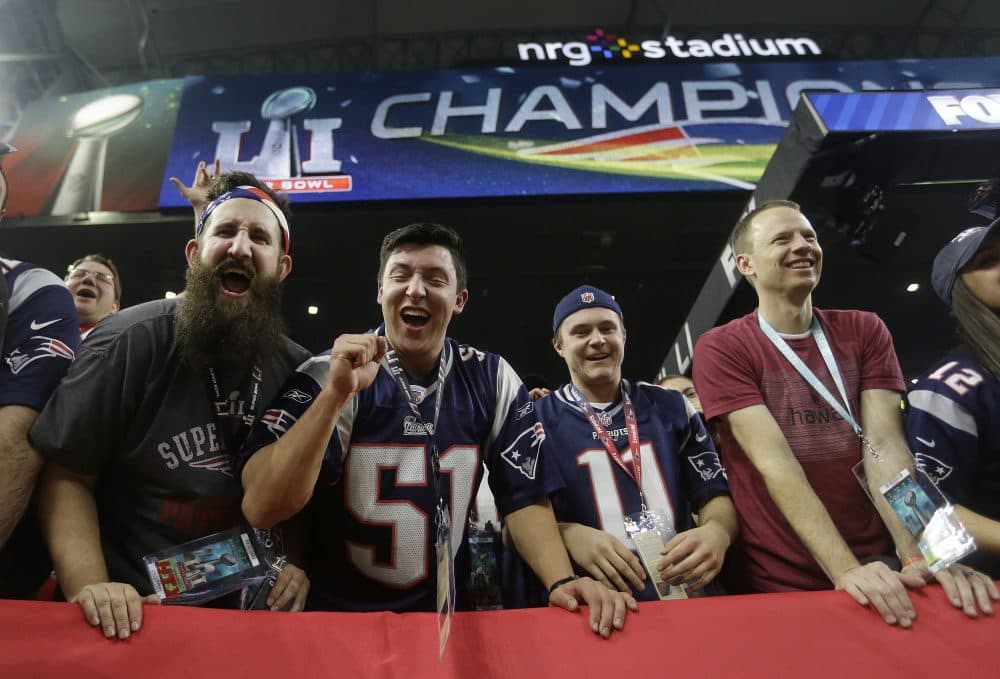 New England Patriots fans celebrate in Houston. (Elise Amendola/AP)
