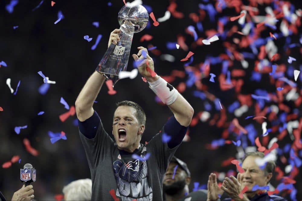 New England Patriots' Tom Brady raises the Vince Lombardi Trophy after defeating the Atlanta Falcons in overtime at the NFL Super Bowl 51. The Patriots defeated the Falcons 34-28. (Darron Cummings/AP)