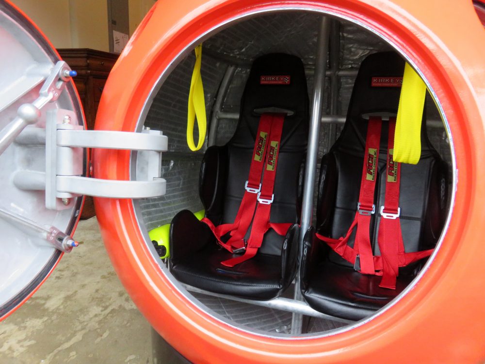 The capsule's seats have shoulder harnesses and seat belts to buckle in tight. (Tom Banse/Northwest News Network)