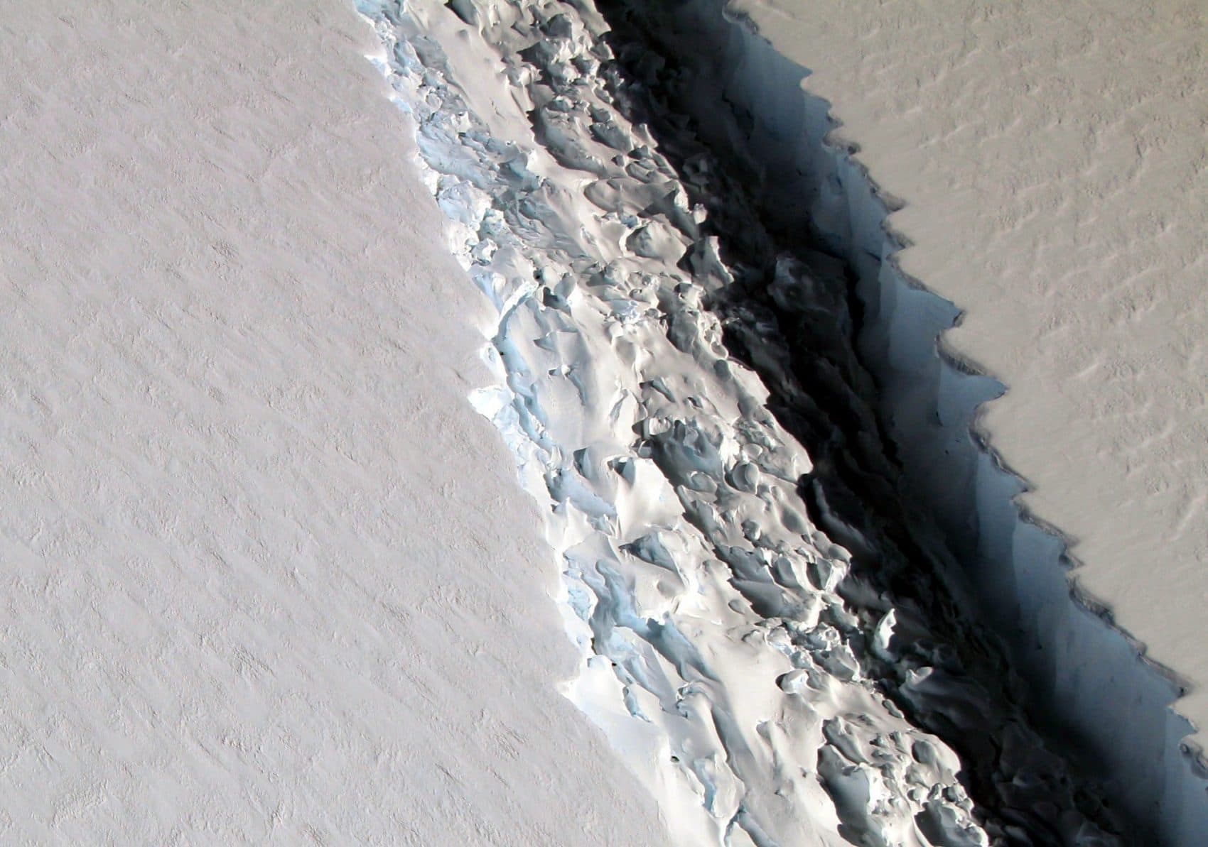 This Nov. 10, 2016 aerial photo released by NASA, shows a rift in the Antarctic Peninsula's Larsen C ice shelf. According to NASA, IceBridge scientists measured the Larsen C fracture to be about 70 miles long, more than 300 feet wide and about a third of a mile deep. (John Sonntag/NASA via AP)