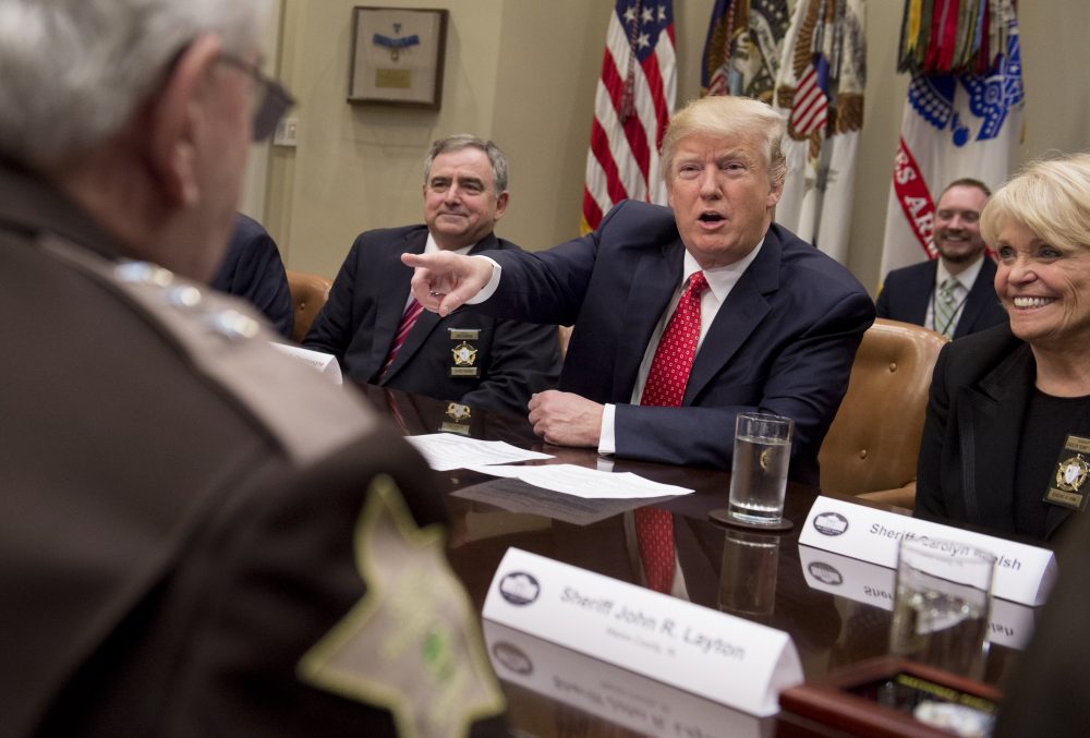 U.S. President Donald Trump speaks alongside Sheriff Carolyn Bunny Welsh (right), of Chester County, Pa., during a meeting with county sheriffs in the Roosevelt Room of the White House in Washington, Feb. 7, 2017. (Saul Loeb/AFP/Getty Images)