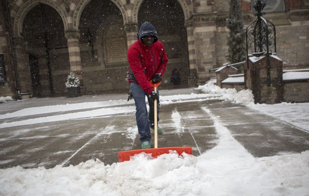 Oppong Serebour is keeping the Boylston Street sidewalk in front of the Old South Church in Copley Square clear for pedestrians. (Jesse Costa/WBUR)