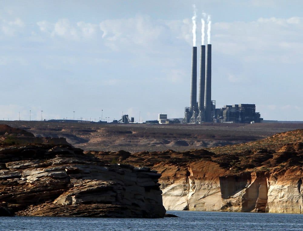 This Sept. 4, 2011 file photo shows the main plant facility at the Navajo Generating Station, as seen from Lake Powell in Page, Ariz. The plant is slated to close in 2019. (Ross D. Franklin/AP)