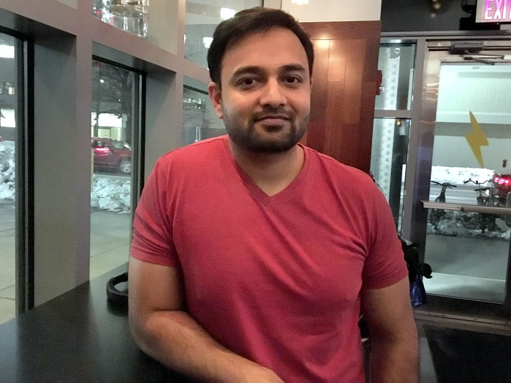 Shoeb Mogal, 30, began working on H1-B visa for a tech company in Kendall Square after graduating from Northeastern. (JAsma Khalid/WBUR)