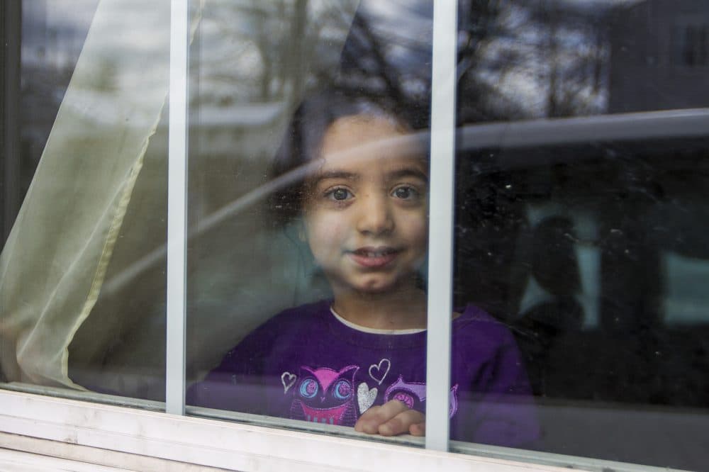 Four-year-old Tuka looks out the window. (Jesse Costa/WBUR)