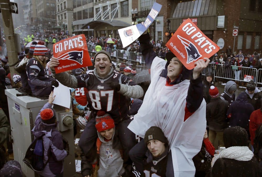 New England Patriots fans wait for the start of the parade Tuesday in Boston. (Charles Krupa/AP)