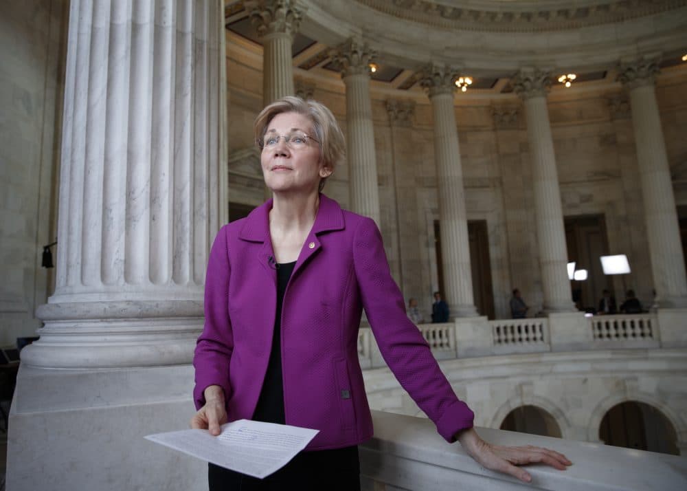 Sen. Elizabeth Warren holds a transcript of the speech that got her barred participating in debate on the Senate floor about Jeff Sessions nomination to be named attorney general. (J. Scott Applewhite/AP)