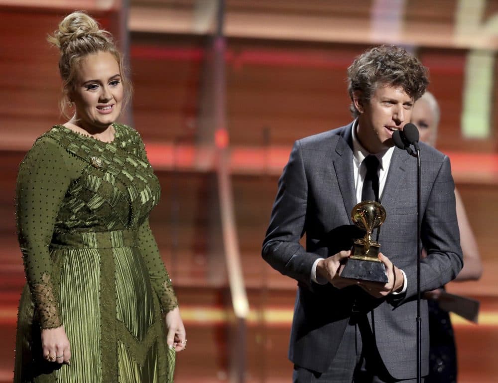 Greg Kurstin, right, and Adele accept the award for song of the year for &quot;Hello.&quot; (Matt Sayles/Invision/AP)