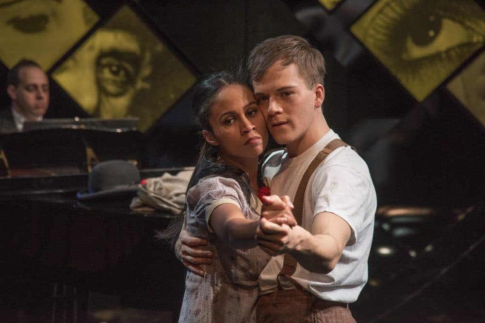 Music director Matthew Stern plays piano in the background as Carla Martinez and Jake Murphy dance. (Courtesy Andrew Brilliant/New Repertory Theatre)